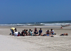 students helping with banding the shore birds