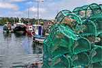 Photo of fishing boats and lobster traps pixabay Richard442
