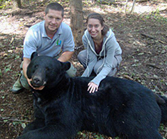 student and mentor with black bear