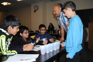 Photo: students observing their experiments