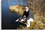 Ryan Batt takes a reading of oxygen levels in a Center for Limnology study lake in Northern Wisconsin. Photo courtesy of STEVE CARPENTER