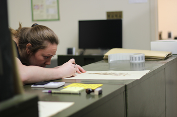 Megan King working in the Chrysler Herbarium. Photo courtesy of Devika Jaikumar