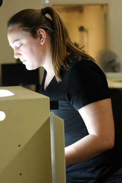 Megan King working on preserving a plant species. Photo courtesy of Devika Jaikumar