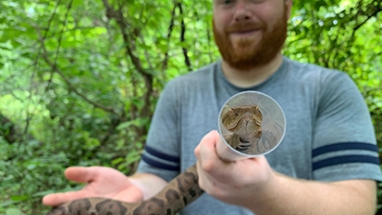 Bobby Kwait holds snake