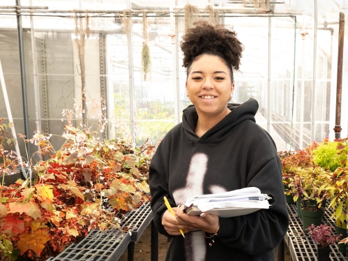 Student in the floriculture greenhouse