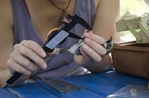 Nicole using a caliper, photo courtesy of Nicole Guido