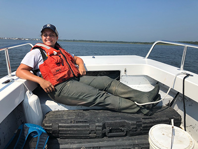 Photo: Brianna Cerione in a boat USFWS